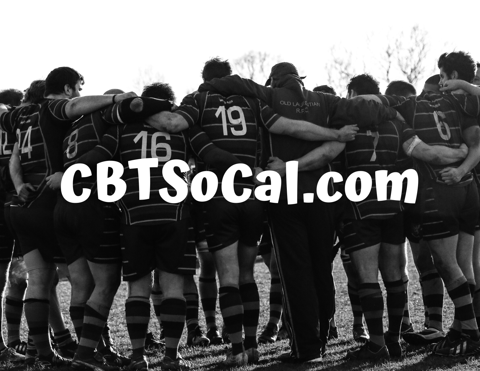 Rugby players huddle together supporting each other mentally and physically