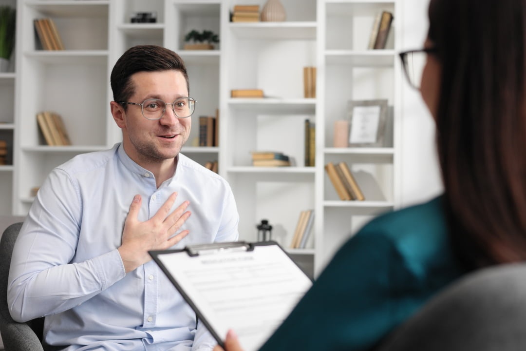 man smiling in therapy